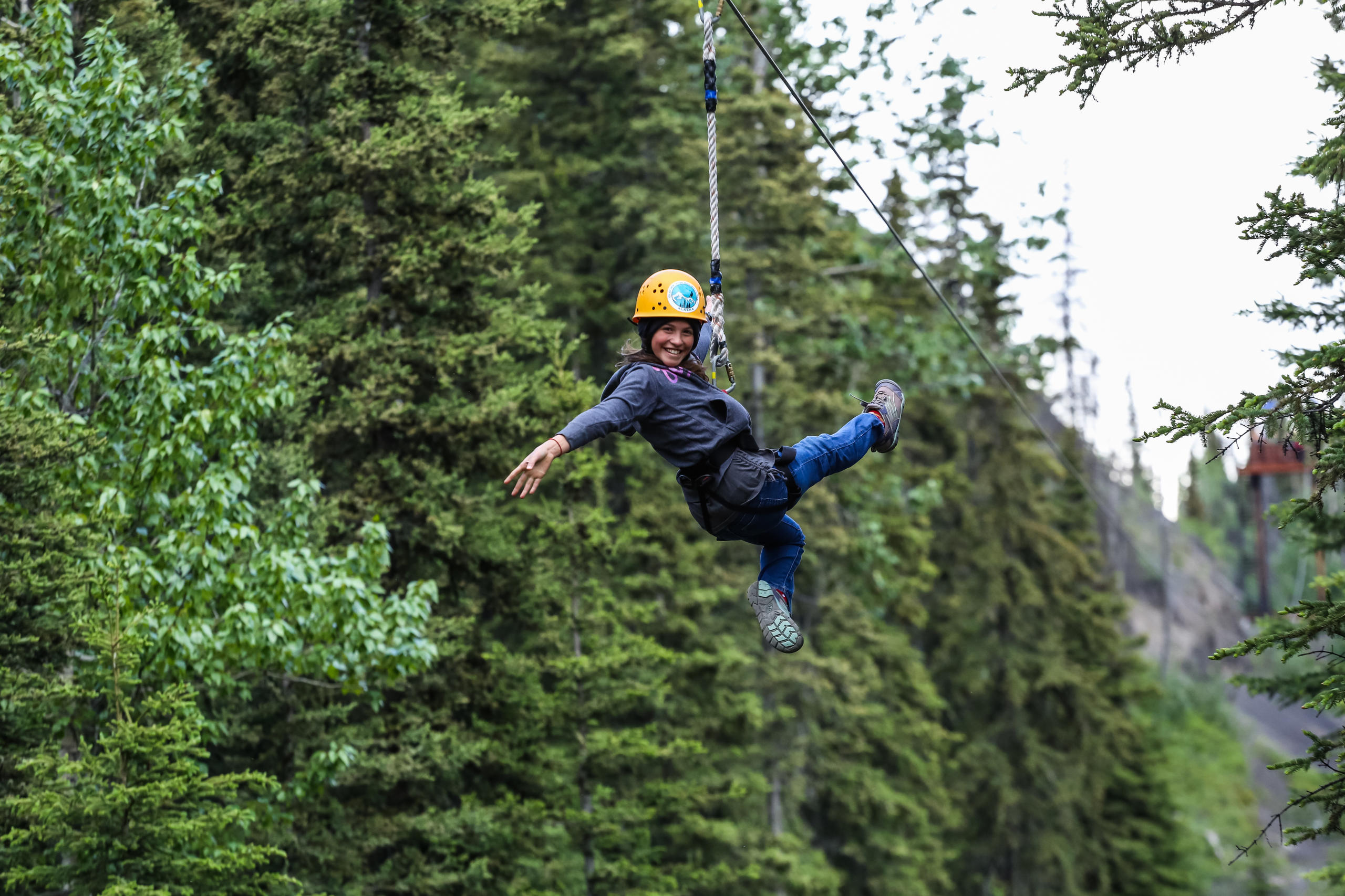 a man flying through the air while riding skis